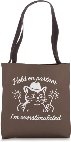 HOLD ON PARTNER I'M OVERSTIMULATED - Cat holding sparklers Tote Bag